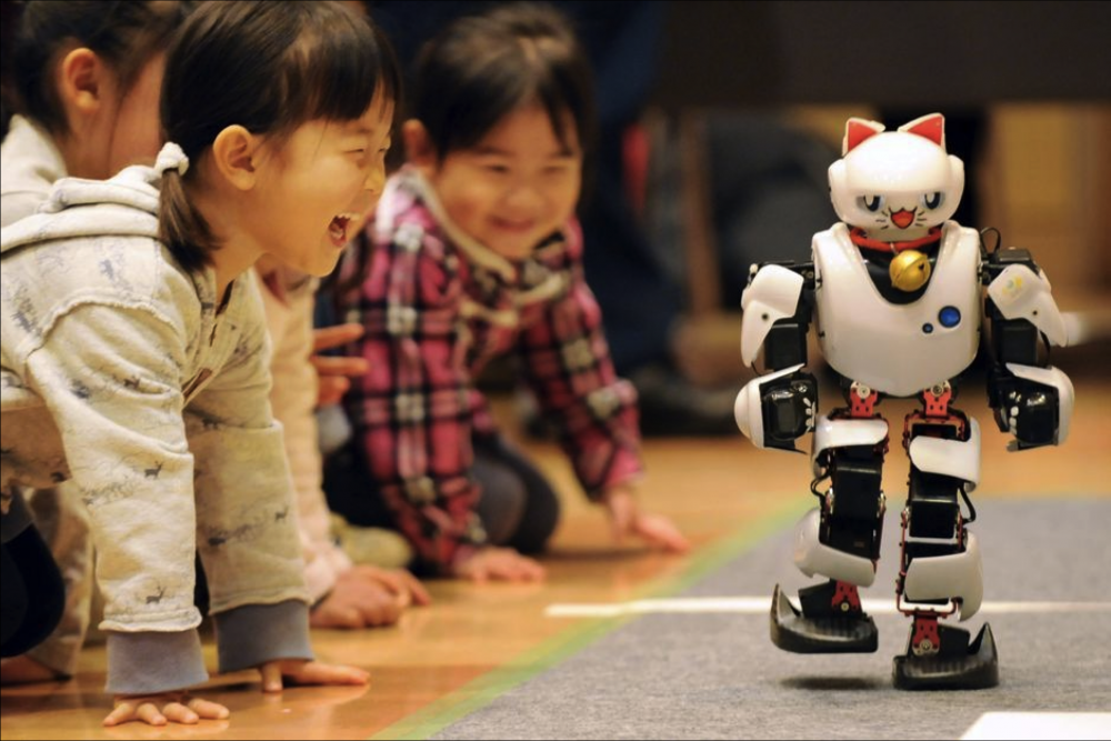 children-playing-with-robot.png